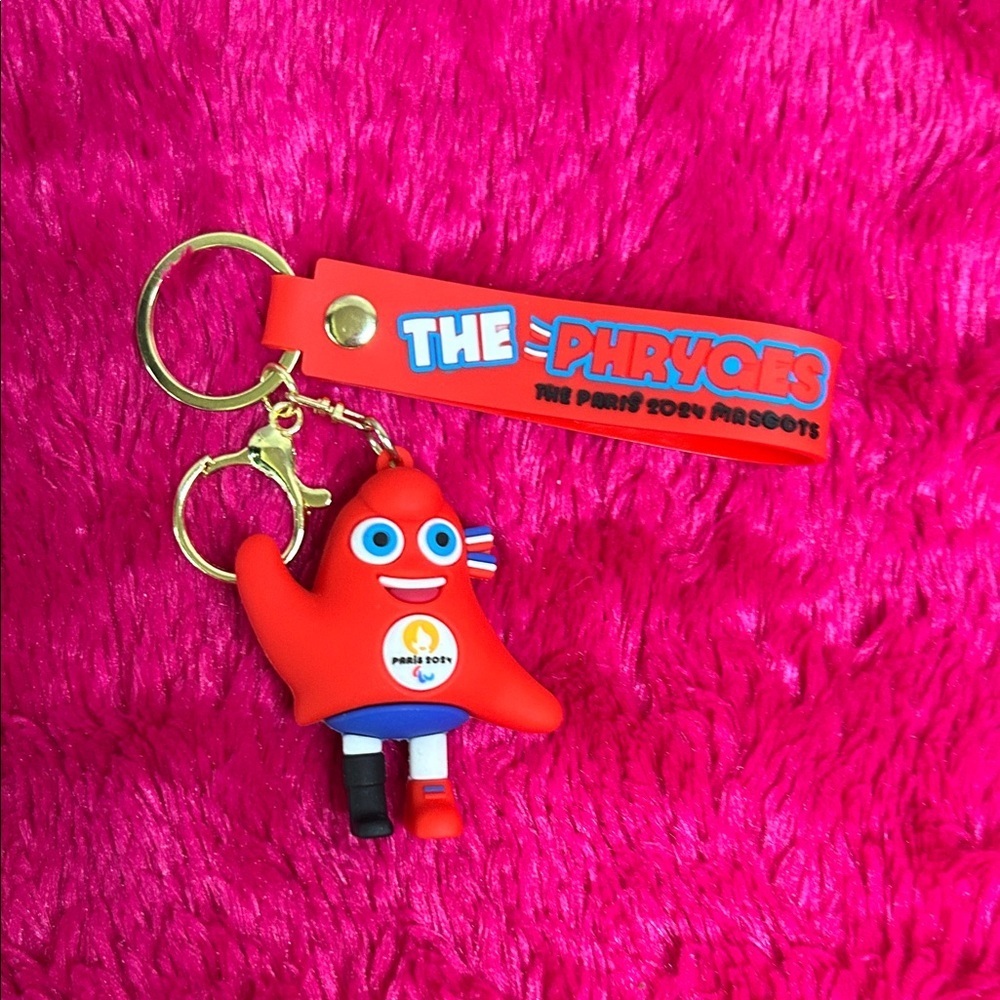 Red Keychain Toy with Blue and Black Accents